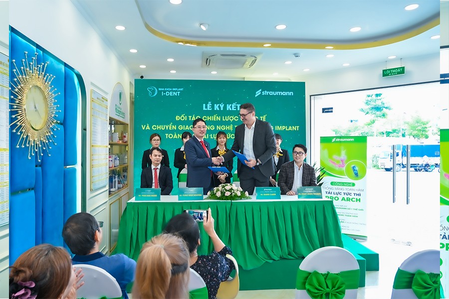 Representatives of both organizations signing the cooperation agreement