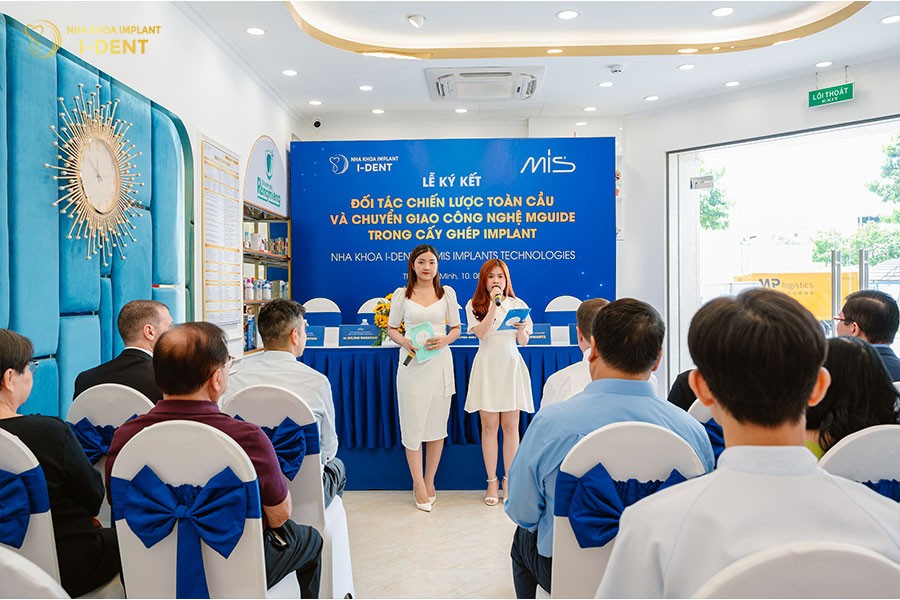 The I-DENT dental team and loyal patients attending the signing ceremony